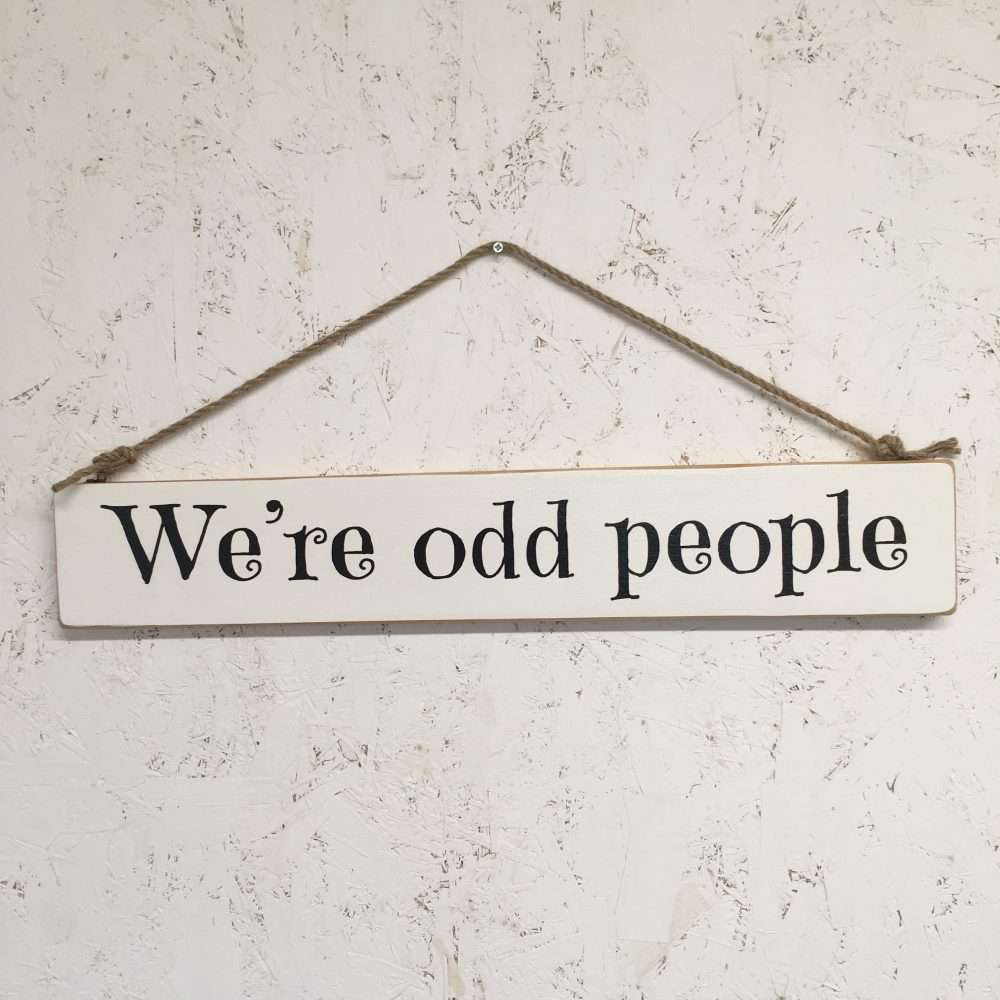 Wooden sign - we're odd people